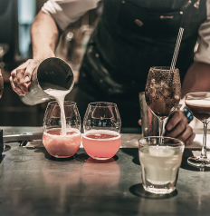 Bartender pouring drinks