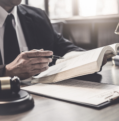 Professional Using Pen in Book